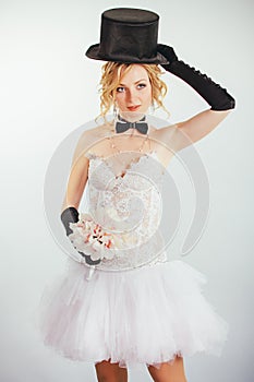 Blonde bride in tophat with veil and long black gloves