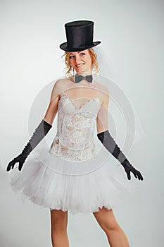 Blonde bride in tophat with veil and long black gloves