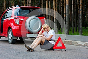 Blonde and broken car