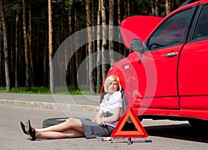 Blonde and broken car