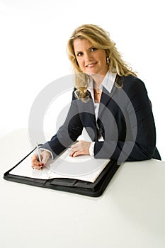 Blonde business woman taking notes