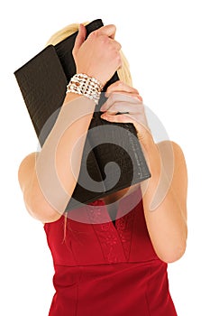 Blonde businesswoman hiding