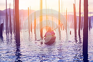 Blonde Caucasian Young Woman Kayaking in Stave Lake