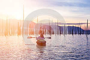 Blonde Caucasian Young Woman Kayaking in Stave Lake