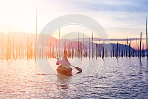 Blonde Caucasian Young Woman Kayaking in Stave Lake