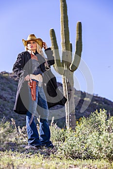 Blonde Cowgirl With Weapons In The American Southwest