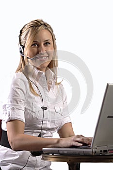 Blonde customer service girl working on laptop