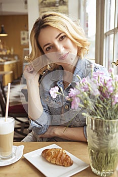 Blonde with dark roots caucasian woman in casual summer outfit