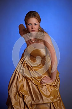 Blonde in an elegant gold dress