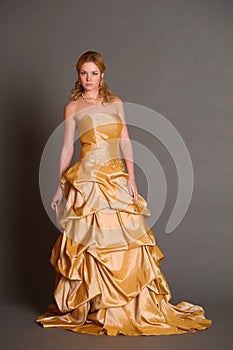 Blonde in an elegant gold dress