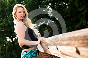 blonde fashion model on a bridge