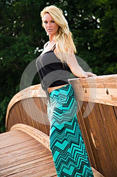 blonde fashion model on a bridge