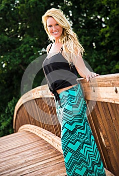 blonde fashion model on a bridge