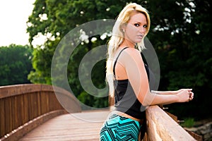 blonde fashion model on a bridge