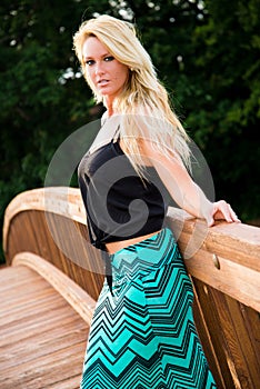 blonde fashion model on a bridge