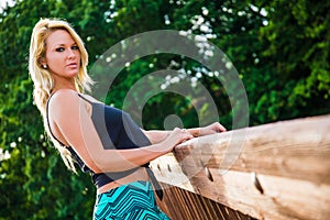 blonde fashion model on a bridge