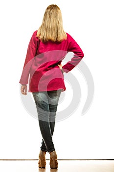 Blonde fashionable woman in vivid color coat.