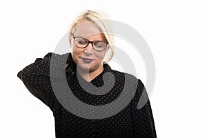 Blonde female teacher wearing glasses showing neck pain gesture