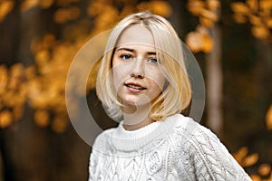 Blonde with freckles short haircut in autumn