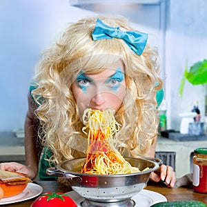 Blonde funny on kitchen eating pasta like crazy