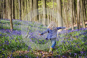 Blonde girl and bluebells at Hallerbos woods