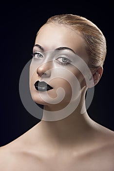 Blonde girl with dark lipstick turned of three quarters