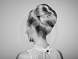 Blonde girl with elegant and shiny hairstyle