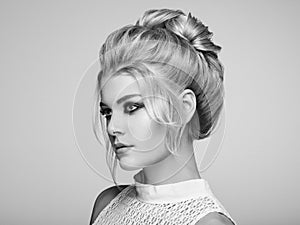 Blonde girl with elegant and shiny hairstyle