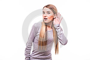 Blonde girl with hands near earns on white background photo