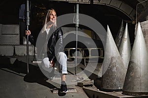 A blonde girl inside a military decommissioned An-12 cargo plane photo