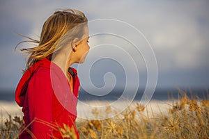 Blonde girl looking at the horizon