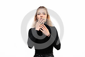 Blonde girl looking worried, anxious, stressed and afraid, hold hands near mouth. Studio shot white background, isolated