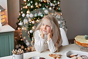 Blonde girl in the New Year`s kitchen photo