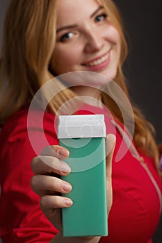 a blonde girl with an overweight plus size, in a red overallposing on a dark Studio background