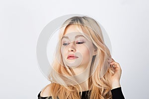 Blonde girl with pink eye shadows on her face