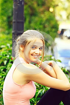 Blonde girl in pink shirt