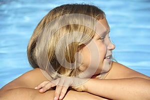 Blonde girl in the pool portrait