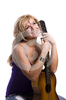 Blonde Girl sitting with guitar
