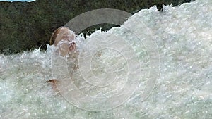 Blonde girl slapped by wave