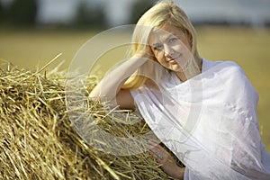 Blonde girl in sloping field