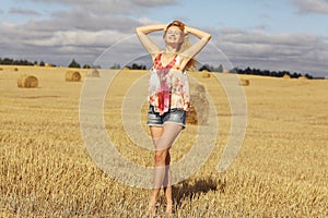 Blonde girl in sloping field