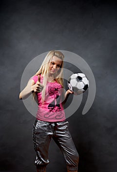 Blonde girl with soccer ball