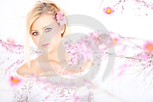 Blonde girl with spring blossoms