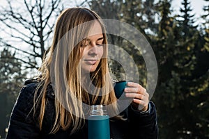 Blonde girl with tea