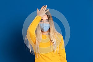 Blonde girl wearing a face mask