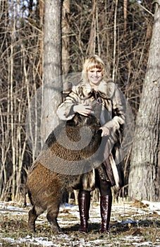 Blonde girl with wild boar