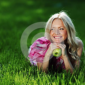 Blonde on green grass