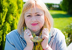 Blonde hair plus size woman portrait  smoking at city