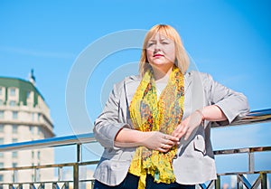 Blonde hair plus size woman portrait  smoking at city