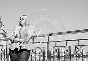 Blonde hair plus size woman portrait  smoking at city